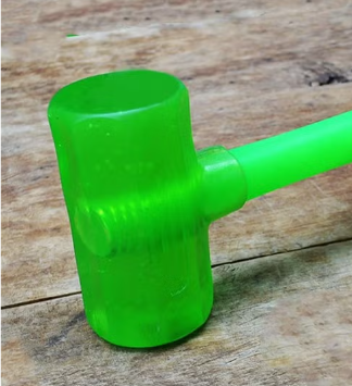 Rubber hammer with a clear head design,